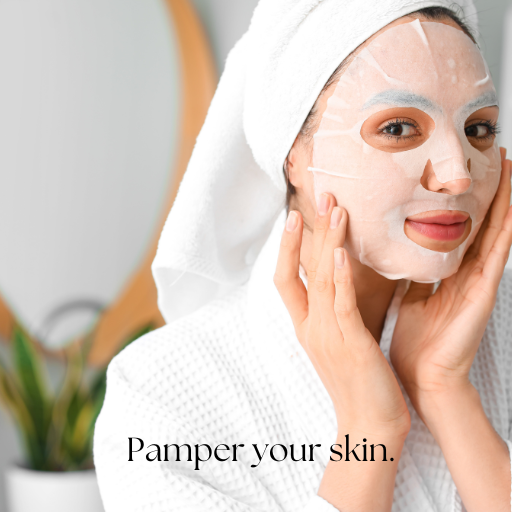 woman with hair wrapped in a towel while holding her hands to her face that has a white face sheet mask on it