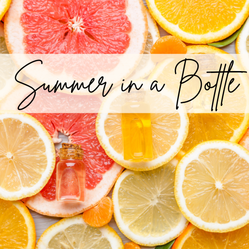 summer in a bottle with sliced citrus fruit and essential oil bottles 