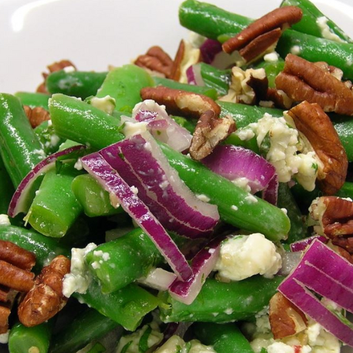 Fresh green bean salad with red onion, feta cheese and toasted pecans