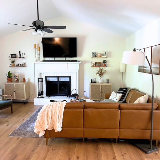 living room view with tv over fireplace