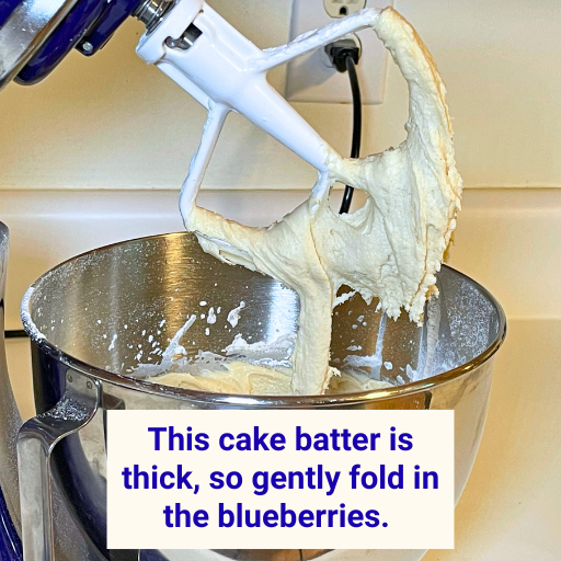 This cake batter is thick, so gently fold in the blueberries.