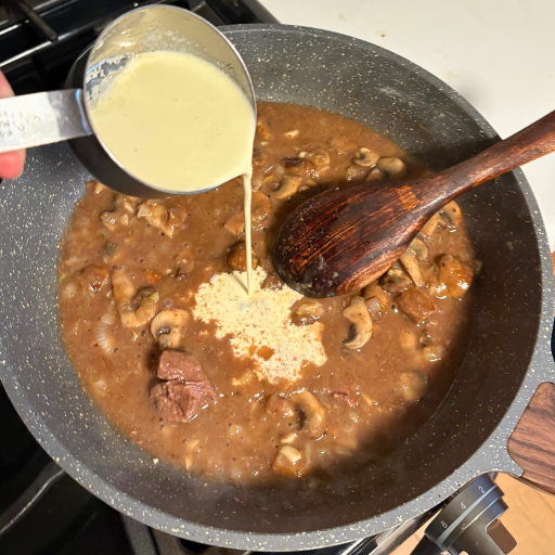pouring cream into the saute pan