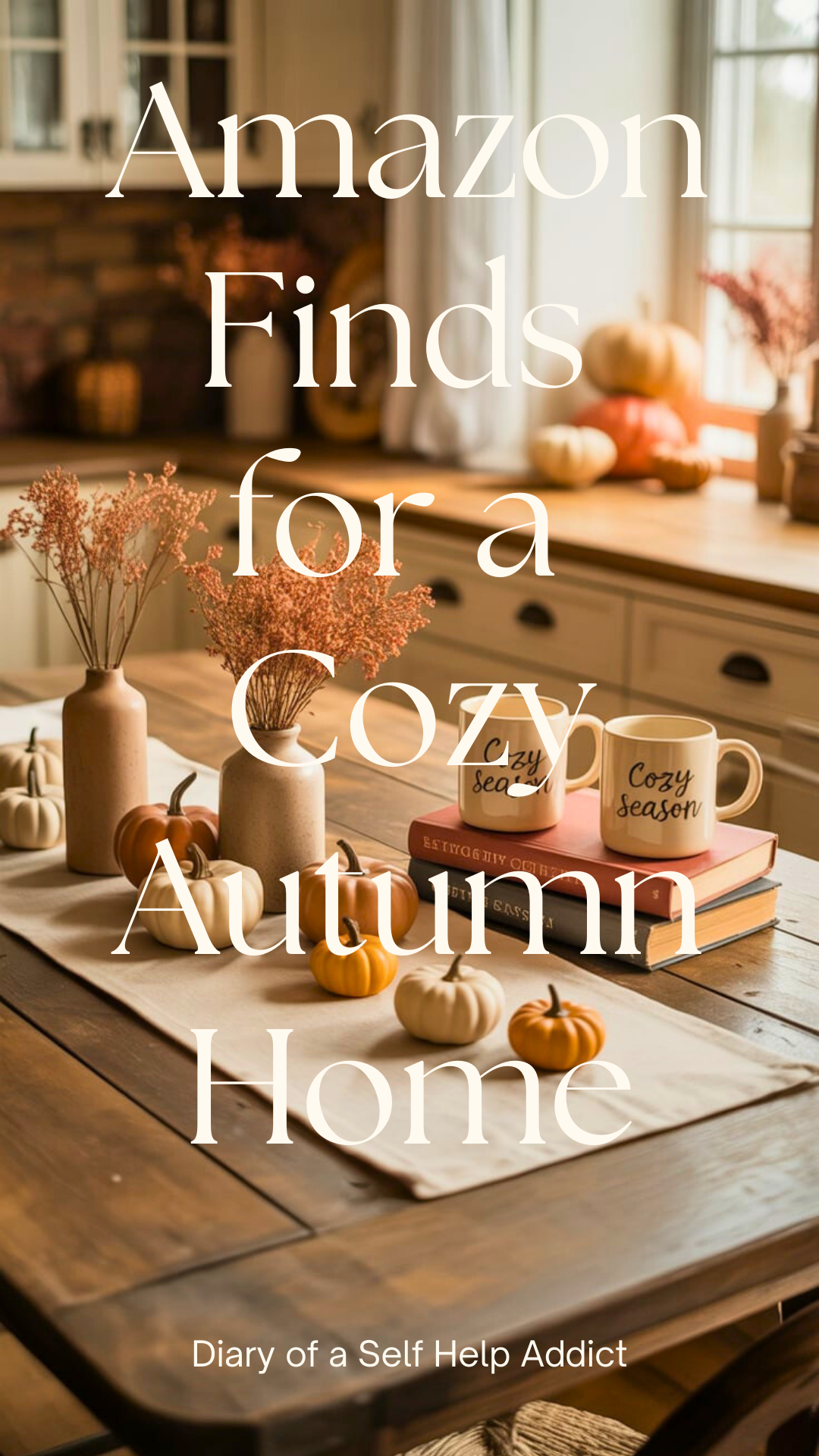 A rustic wooden table with a warm-toned table runner, mini faux pumpkins, dried flower arrangements in neutral vases, and a set of fall-themed mugs.