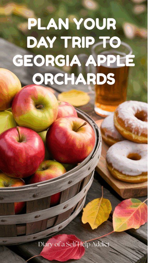 Close-up of fresh picked apples in a rustic wooden basket, with apple cider donuts and hot cider nearby on a farm table. Bright fall leaves scattered around.