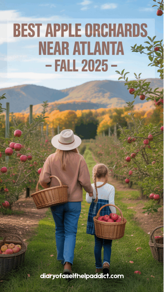 A mom and daughter holding hands and carrying baskets of apples on a sunny fall day in an orchard, with apple trees and mountains in the distance.