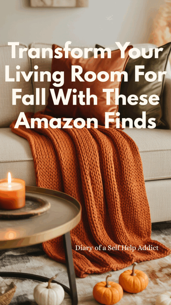 A living room with a burnt orange chunky knit throw draped over a neutral sofa, velvet pillows in rust and olive, a coffee table with a pumpkin spice candle, small faux pumpkins scattered around, warm lighting, and a soft rug.
