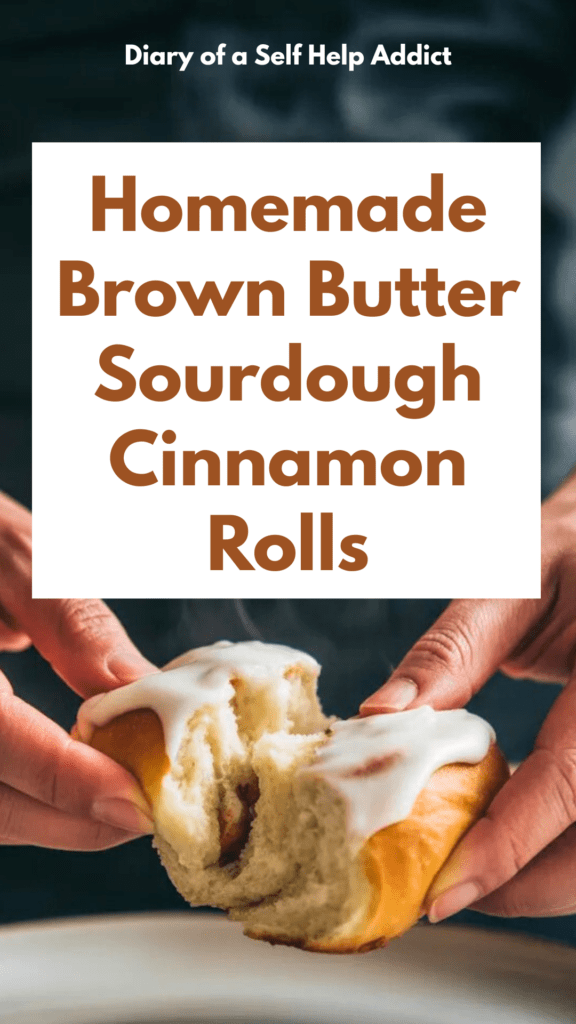 Hands pulling apart a warm sourdough cinnamon roll, steam rising, soft stretchy crumb, thick frosting, cozy morning vibe, neutral color palette, cinematic food photography