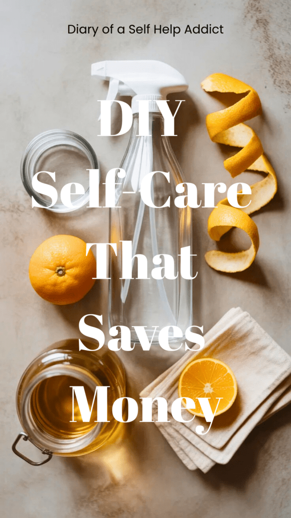 A flat lay of DIY cleaning supplies: glass spray bottles, citrus peels, vinegar jar, and folded reusable cloths on a neutral background.