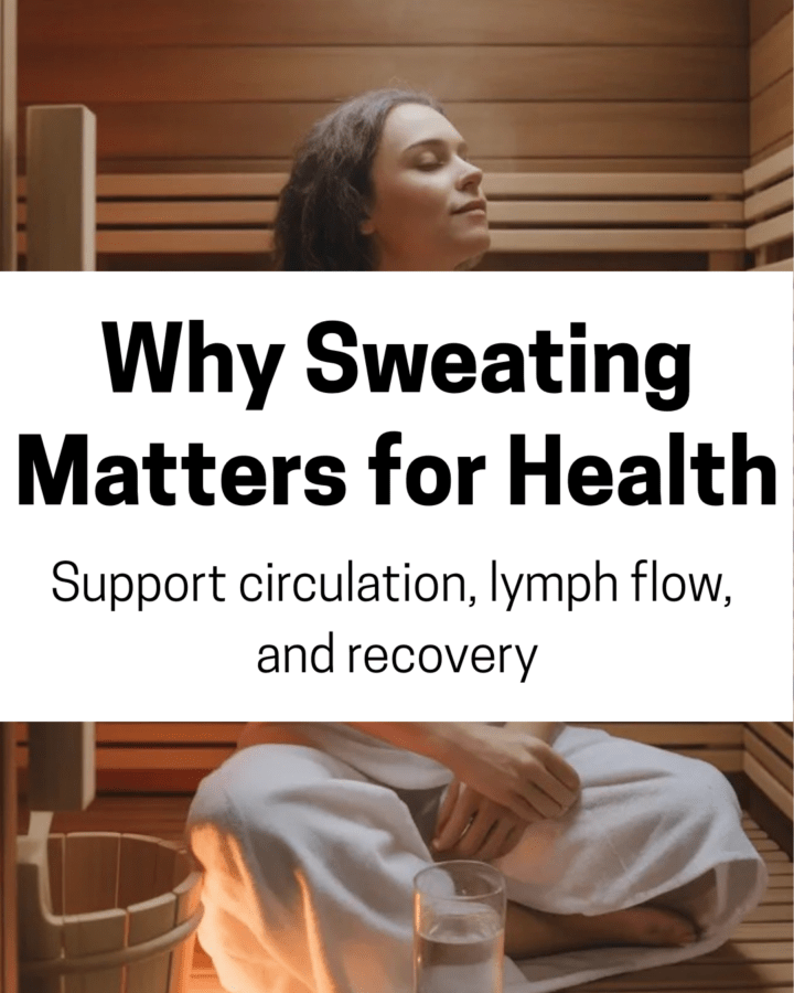 A person sitting peacefully in a home sauna with soft natural lighting, gentle steam rising, a glass of water nearby to suggest hydration and self-care.