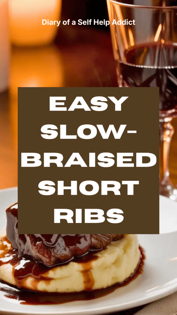 Braised short ribs served over creamy mashed potatoes with sauce spooned on top, glass of Cabernet Sauvignon beside plate, linen napkin, warm candlelight, intimate dinner atmosphere.