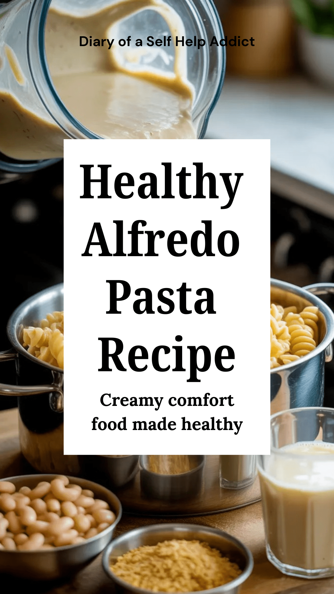 Blender pouring creamy white bean Alfredo sauce over chickpea pasta in a pot. Ingredients (beans, soy milk, nutritional yeast) sitting beside the blender.