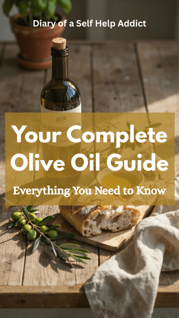 A rustic wooden kitchen countertop featuring a dark glass bottle of extra virgin olive oil, a small dipping bowl filled with golden olive oil, fresh green olives on branches, crusty artisan bread, rosemary sprigs, garlic cloves, and a linen kitchen towel with warm natural sunlight streaming through a nearby window.