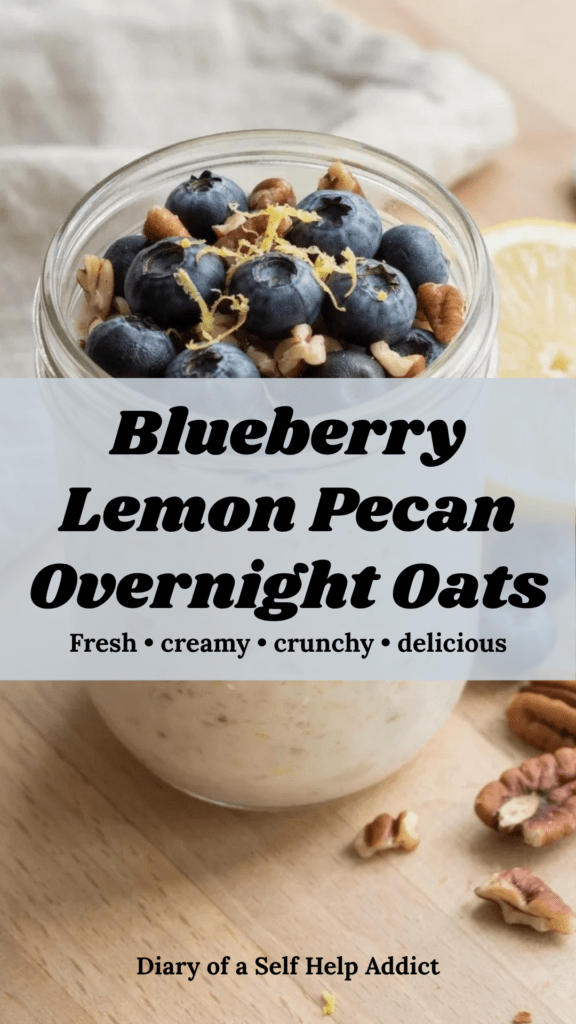 A bright, fresh close-up of creamy overnight oats in a clear glass jar topped generously with fresh blueberries, finely grated lemon zest, and chopped pecans. A few blueberries, a lemon half, and scattered pecans surround the jar on a light kitchen surface. Natural morning light, fresh and wholesome but still delicious and inviting.