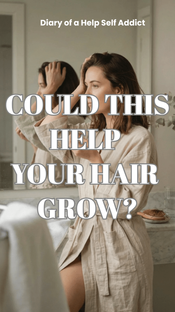 A close-up lifestyle image of a woman gently running her fingers through her hair while looking thoughtfully into a mirror. A few strands of hair are visible in her hand, creating an emotional but not overly dramatic representation of post-illness hair shedding. Natural bathroom lighting.