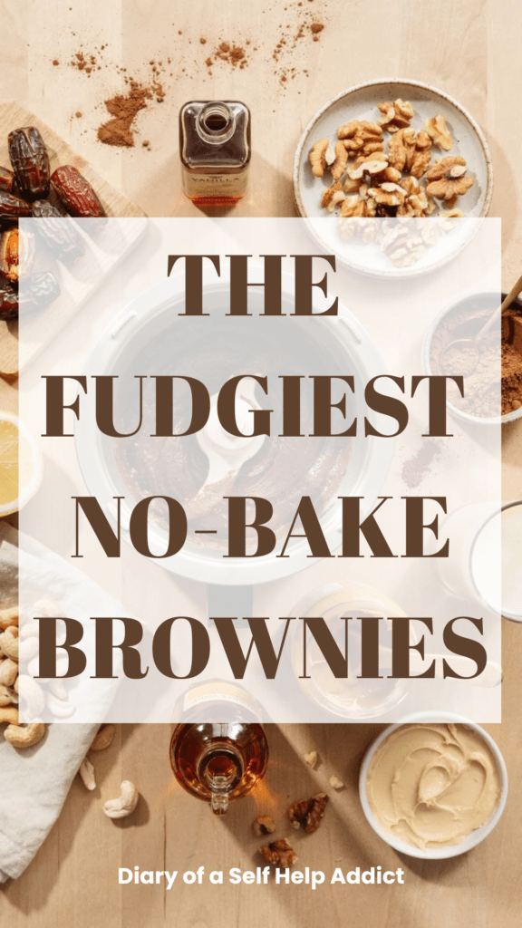 Beautiful overhead flat-lay showing Medjool dates, walnuts, cocoa powder, peanut butter, raw cashews, lemon, vanilla, maple syrup, and a small bottle or glass of plant milk arranged around a food processor containing the chocolate brownie mixture. Include a small dish of prepared cashew frosting. Warm neutral kitchen background and natural lighting.
