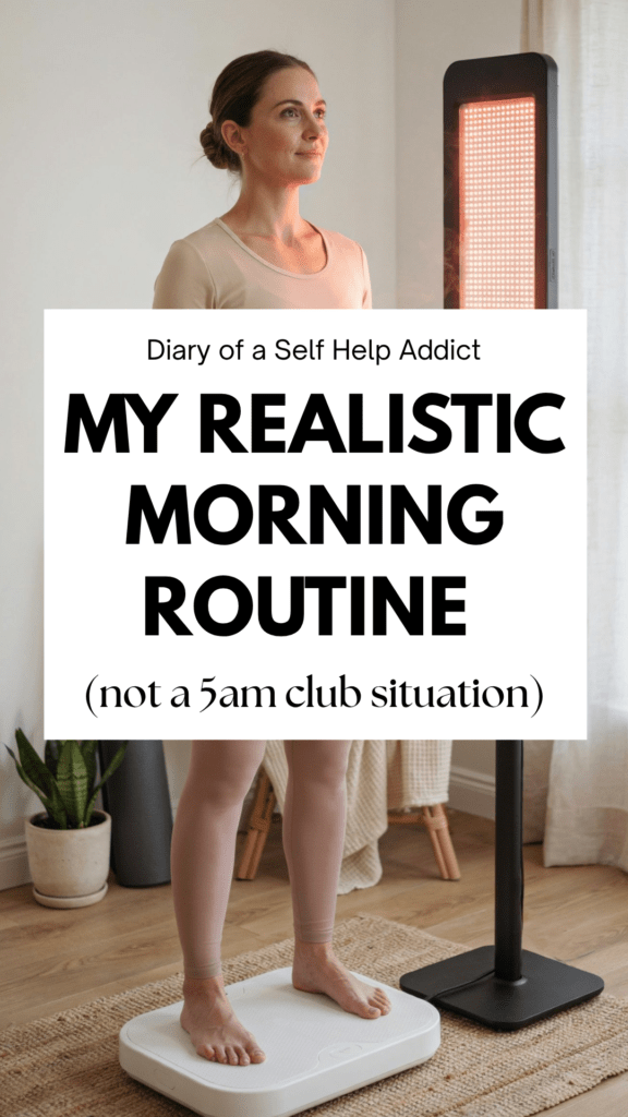 A woman standing on a vibration plate in a bright home wellness corner, facing a red light therapy panel that's glowing warmly, soft morning light, cozy minimalist room with a yoga mat rolled nearby and a small plant, calm focused expression, athleisure in neutral tones, wellness-lifestyle photography style, no text.