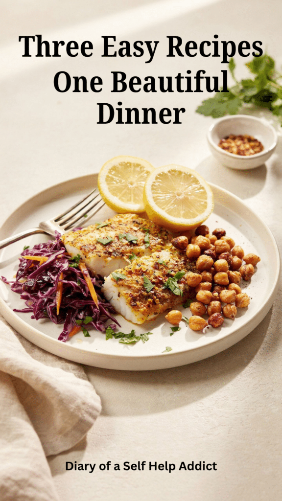 A bright dinner photograph featuring a baked cod fillet covered in the golden yogurt and spice marinade, served beside purple cabbage slaw and crispy roasted chickpeas. The cod should look moist and flaky, with one small section gently separated by a fork to show its texture. Include fresh lemon and a little chopped cilantro. Use natural window light and a clean neutral background so readers immediately understand that the same marinade works beautifully with white fish.