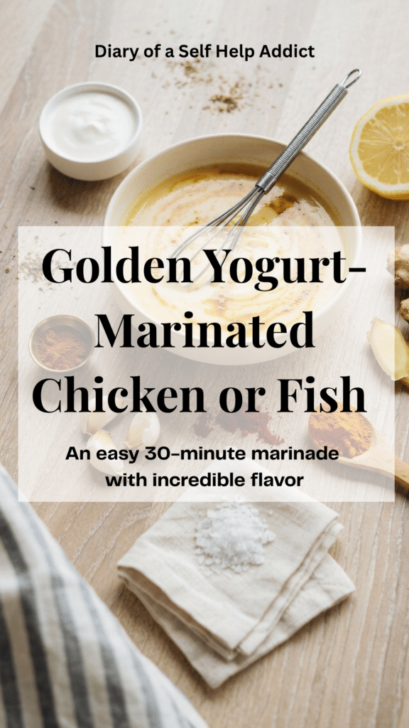 An overhead preparation scene showing a bowl of creamy golden yogurt marinade surrounded by the simple whole-food ingredients used to make it: plain yogurt, fresh ginger, garlic cloves, a cut lemon, turmeric, garam masala, cayenne, and salt. Include a small whisk resting in the bowl and visible swirls of spice throughout the yogurt. Use a light wood or white stone surface with casual, home-kitchen styling that makes the recipe feel easy and doable.
