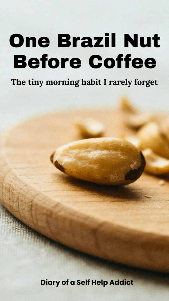 A close-up of one Brazil nut centered on a small wooden cutting board, with several additional Brazil nuts softly blurred in the background. Include plenty of open space around the single nut to emphasize the “just one” message and allow room for a Pinterest text overlay.