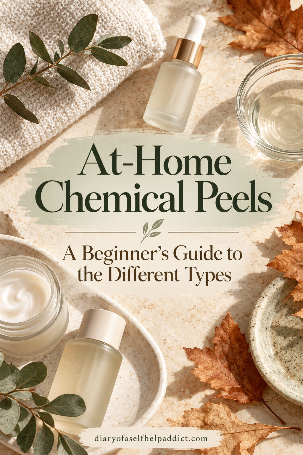 Skincare bottles, a towel, and autumn leaves arranged on a cream-colored surface, with the text “At-Home Chemical Peels: A Beginner’s Guide to the Different Types.”