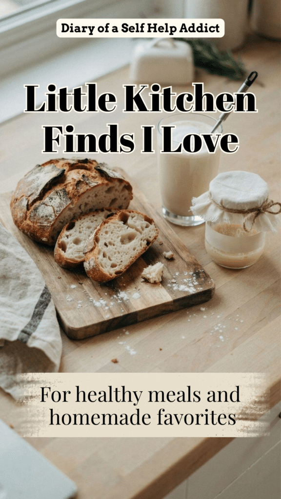 A rustic sourdough loaf with several slices on a wooden board beside a creamy coffee and handheld electric whisk. Include a starter jar and folded linen towel. Warm, casual, and inviting. Optional text: “Little Kitchen Finds I Love.”