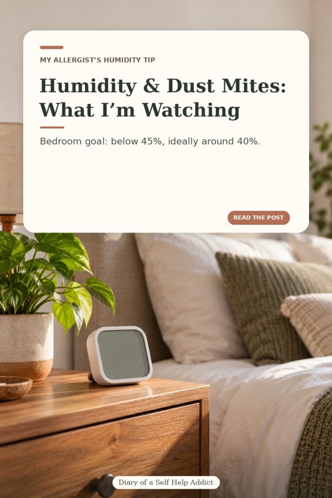 Vertical photo of a small humidity monitor on a bedside table, with a softly made bed and plant in the background. The text reads “Humidity & Dust Mites: What I’m Watching” and “Bedroom goal: below 45%, ideally around 40%.” Discreet Diary of a Self Help Addict signature below.